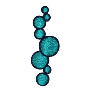 May include: A teal blue embroidered patch with a design of overlapping circles. The circles are outlined in dark blue.