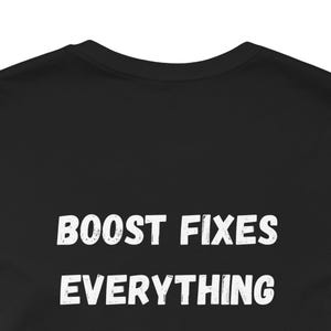 May include: Black t-shirt with the white text "BOOST FIXES EVERYTHING". The text is in a bold, sans-serif font. The shirt has a crew neck and is made of a soft material.