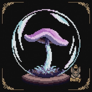 May include: A cross-stitch pattern on a black background featuring a purple and white mushroom inside a circular frame. The mushroom has a light blue stem and sits on a brown base. The text "THE BIG Buffy" appears in the bottom right corner.