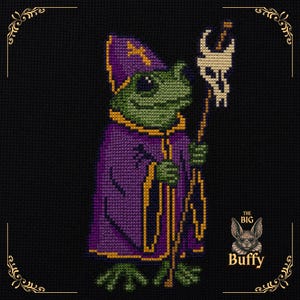 May include: A cross-stitch pattern on black fabric featuring a green frog dressed in a purple and gold robe and matching pointed hat. The frog holds a staff topped with a white skull-like ornament. The text THE BIG Buffy appears in the corner.