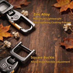 May include: Close-up of two metal keychains with a square buckle design. The keychains are made of zinc alloy and have an electroplating coating. The text on the image reads "Zinc Alloy, Maximum Lightweight, Electroplating Coating Process" and "Square Buckle, Allow more flexible adjustment."