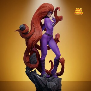 May include: A purple superheroine statue with long, flowing red hair and a matching mask. She wears a purple jumpsuit, boots, and gloves, standing on a rocky base. The statue has the text "KILO POLY FORCE 3D Model | STL File".