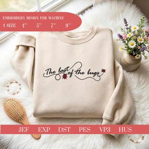 May include: A beige crewneck sweatshirt featuring the black embroidered text "The last of the bugs" with small red ladybug accents. The design is available in 4, 5, 7, and 9 inch sizes for machine embroidery in JEF, EXP, DST, PES, VP3, and HUS formats.