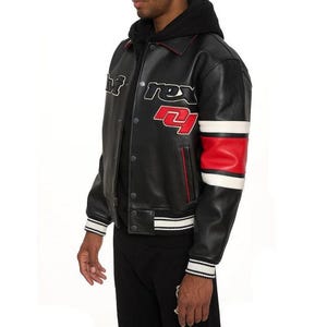 May include: Black leather jacket with white and red accents. The jacket features the text "rex 21" on the chest and a red and white stripe on the sleeve. The jacket has a button-up front and a ribbed hem and cuffs.