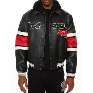 May include: Black leather jacket with red and white accents. The jacket features the text "M" and "rex 4" in white. The sleeves have red and white stripes. The jacket has a button-up front and a ribbed hem and cuffs.