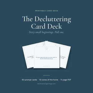 May include: A printable card deck titled "The Decluttering Card Deck" with the tagline "Sixty small beginnings. Pull one." The image shows several white cards with prompts, set against a dark teal background. The deck includes 60 prompt cards, covering 10 zones of the home.