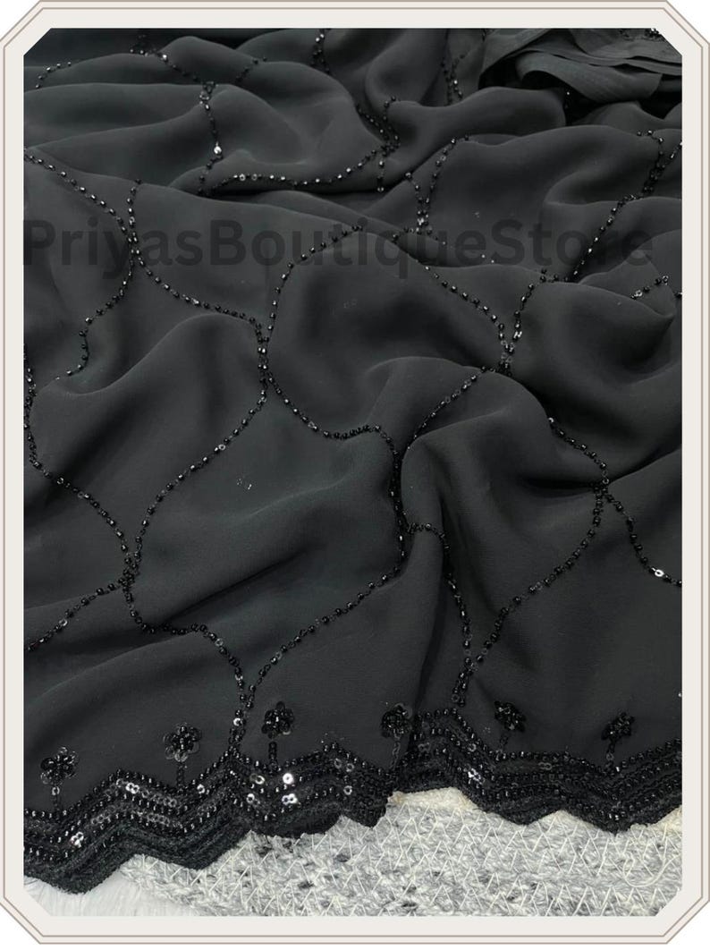 May include: A black fabric textile featuring a delicate grid pattern formed by small, dark sequins. The bottom edge is finished with a wide, scalloped border densely embellished with matching black sequins. The text PriyasBoutiqueStore is visible.