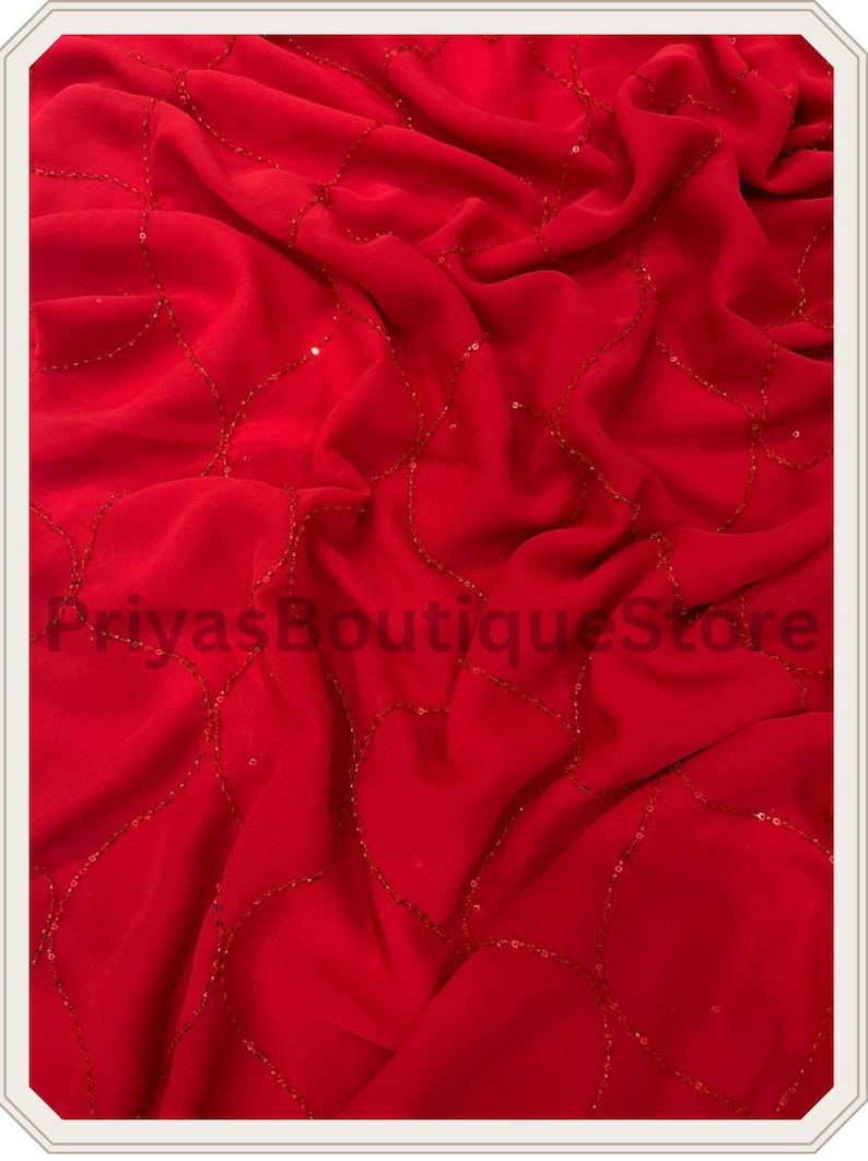 May include: A vibrant red fabric featuring a delicate, flowing pattern of interconnected, curved lines embellished with small, shimmering red sequins. The material is draped in soft folds, and the text PriyasBoutiqueStore is visible.