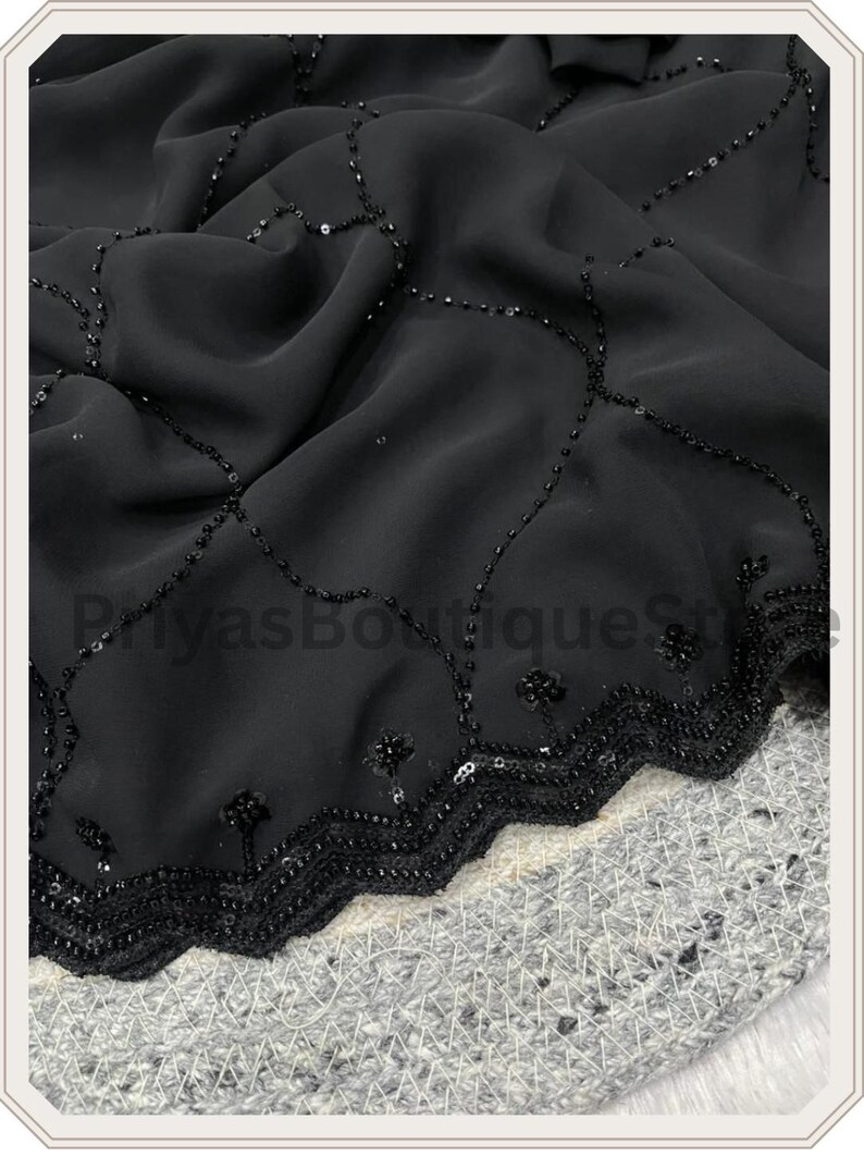May include: A black fabric featuring a delicate scalloped edge adorned with intricate black beadwork and sequins. The material displays a repeating lattice pattern created by fine black beads, with small floral-like clusters at each intersection.
