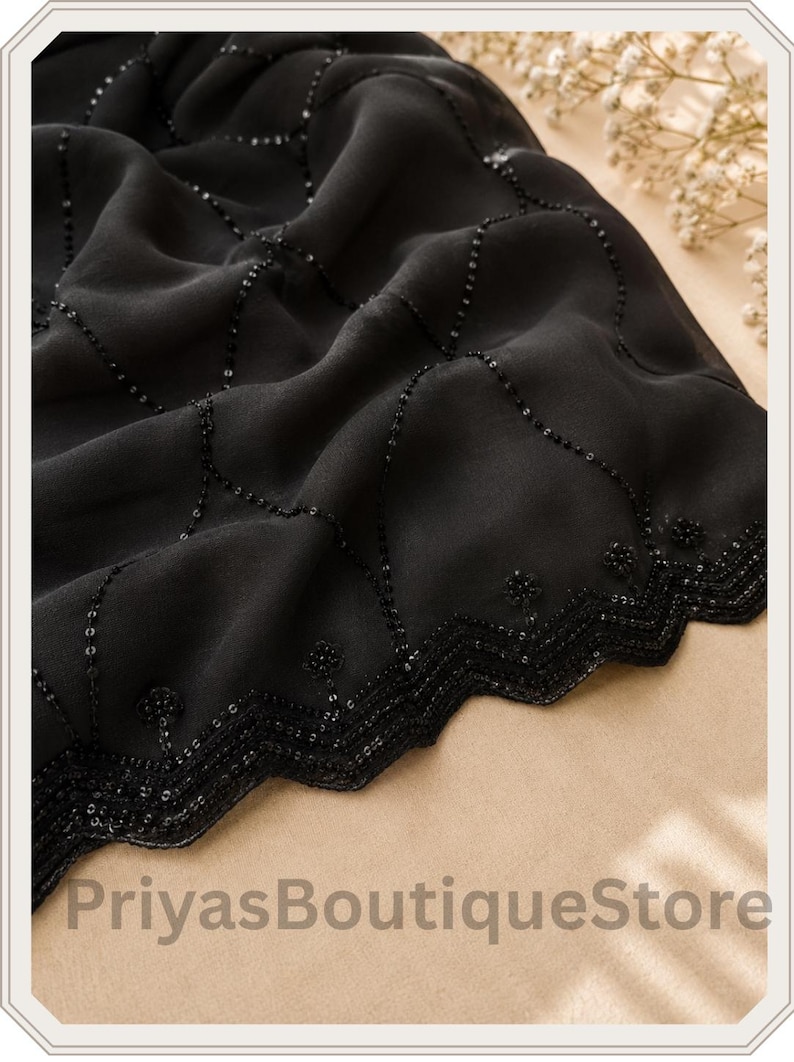 May include: A black fabric textile featuring a delicate diamond-shaped grid pattern embellished with small black sequins. The edge is finished with a decorative zigzag border adorned with intricate beadwork. The text PriyasBoutiqueStore is visible.