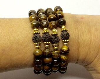 Tiger Eye, essential oil diffuser brown Lava beads with gold tone spacers stretch bracelets.  Two sets of bracelets available.