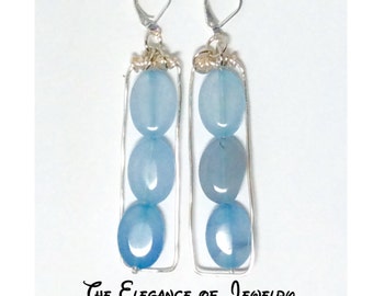 Light blue oval Agate earrings dangle within rectangle hoop earrings -The Elegance of Jewelry