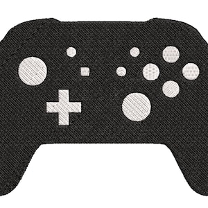 May include: Black video game controller with white buttons.