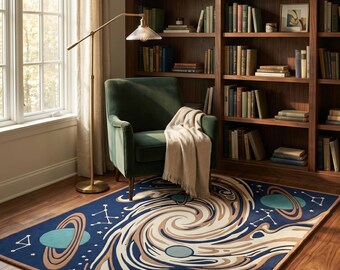 May include: A rectangular area rug featuring a deep blue background with a swirling cream and tan galaxy pattern. The design includes teal planets with rings and white star constellations scattered across the surface, creating a celestial space theme.