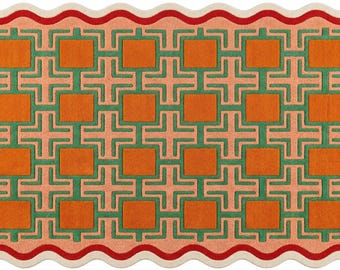 May include: A rectangular rug with a wavy scalloped edge featuring a repeating geometric pattern of orange squares and green cross shapes on a peach background. The border consists of a thick red wavy line framed by a thin cream-colored edge.
