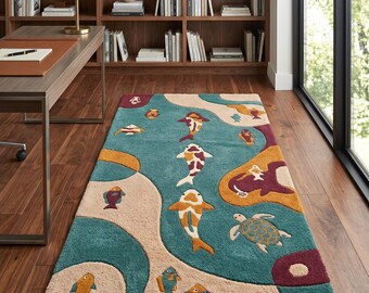 May include: A rectangular area rug featuring a teal background with abstract beige and maroon curved shapes. The rug displays a pattern of various fish, including koi, and a sea turtle in shades of orange, white, yellow, and blue throughout.