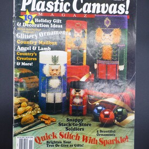 May include: Plastic Canvas! Magazine issue number 35, featuring a cover image of a variety of Christmas ornaments, including a nutcracker, a mailbox, and a stack of soldiers. The magazine title is in bold, red letters. The text "Quick Stitch With Sparkle!" is in bold, red letters. The text "19 Holiday Gift & Decoration Ideas" is in black letters. The text "Snappy Stack-to-Store Soldiers" is in black letters. The text "5 Beautiful Ornaments" is in black letters.