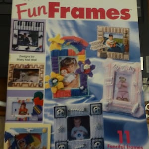 May include: A book cover with the title "FunFrames" in red and white letters. The book features 11 different plastic canvas frame designs for photographs. The designs include a piano, a flower, a baby, a soccer ball, and a beach scene.