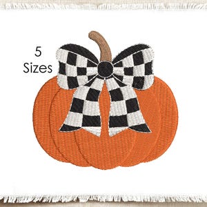 May include: An orange pumpkin embroidery design featuring a brown stem and a large black and white checkered bow. The text 5 Sizes is printed to the left of the pumpkin. The design is centered on a white fabric square with frayed edges.