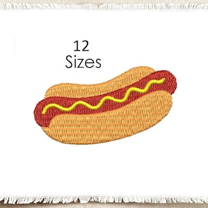 May include: An embroidery design featuring a hot dog in a bun with a wavy line of yellow mustard on top. The text 12 Sizes is printed above the hot dog. The design is centered on a white fabric square with frayed edges on all four sides.