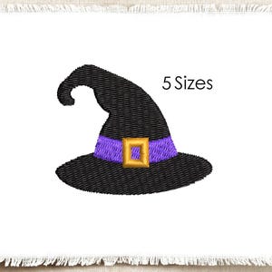 May include: An embroidery design of a black witch hat with a purple band and a gold square buckle. The hat features a curved top and a wide brim. The text 5 Sizes is printed in black to the right of the hat. The design is on a white fabric background.