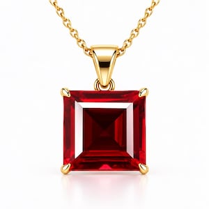 May include: A gold necklace featuring a square-cut, deep red gemstone pendant held by four prongs. The pendant is suspended from a delicate gold chain, showcasing a polished metal finish and a vibrant, faceted red stone with sharp corners.