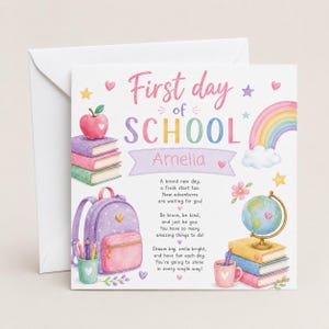 May include: A square greeting card featuring the text First day of SCHOOL Amelia with watercolour illustrations of a stack of books, a red apple, a purple backpack, a rainbow, a globe, and a pink mug, accompanied by a printed poem.