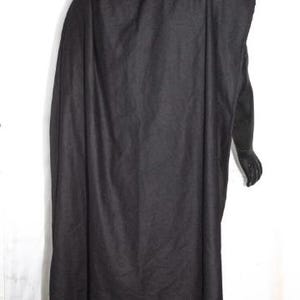 May include: A solid black cloak featuring a simple, unadorned design that drapes over the shoulders and extends down the back. The garment is made of a dark, opaque fabric with a matte texture, covering the upper body and hanging loosely to the waist.