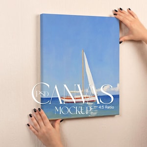 May include: A rectangular canvas print featuring a painting of a white sailboat on blue water under a clear sky. The artwork displays the text PSD CANVAS MOCKUP 4:5 Ratio centered over the image of the boat. The canvas is mounted on a wall.