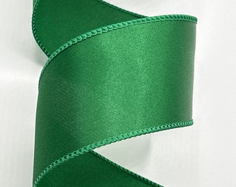 May include: A roll of green satin ribbon with a stitched edge.