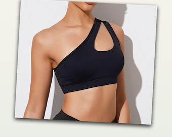 Sujetador deportivo de un solo hombro para mujer, con aberturas, efecto push-up, ideal para gimnasio, entrenamiento, yoga, top deportivo de talla mediana, color negro y blanco.