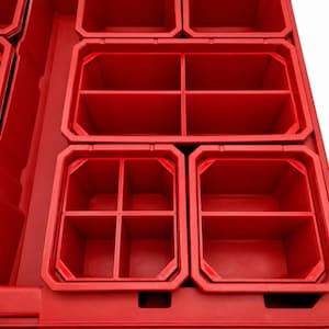 May include: A bright red plastic storage organizer tray featuring multiple rectangular and square compartments. The interior sections are divided by fixed walls, creating various sized bins for sorting small items within the rigid frame.