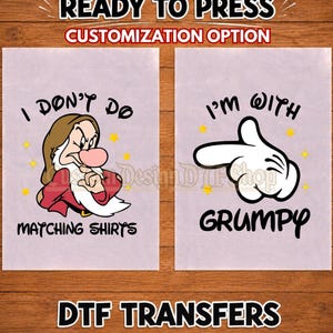 May include: Two DTF transfer sheets featuring cartoon graphics. The left sheet shows a grumpy character with a brown hat and red shirt, with the text I DON'T DO MATCHING SHIRTS. The right sheet shows a white gloved hand pointing, with the text I'M WITH GRUMPY.