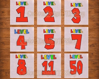 May include: A collection of nine white square DTF transfers featuring the text READY TO PRESS at the top and DTF TRANSFERS at the bottom. Each square displays the word LEVEL in multicolored letters above a large red number, including 1, 2, 3, 4, 5, 7, 8, 11, and 50.