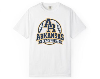 May include: A white short-sleeve t-shirt featuring a navy blue and gold graphic on the chest. The design includes the letters AR, the text ARKANSAS RANGERS, and a baseball stitch pattern enclosed within a circular border with two small stars.