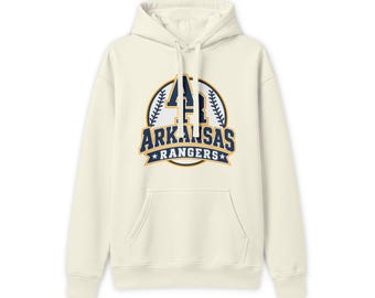 May include: A cream-colored hooded sweatshirt featuring a graphic on the chest with the text AR ARKANSAS RANGERS in navy blue and gold. The design includes a circular baseball-themed border with stitching details and two small stars.