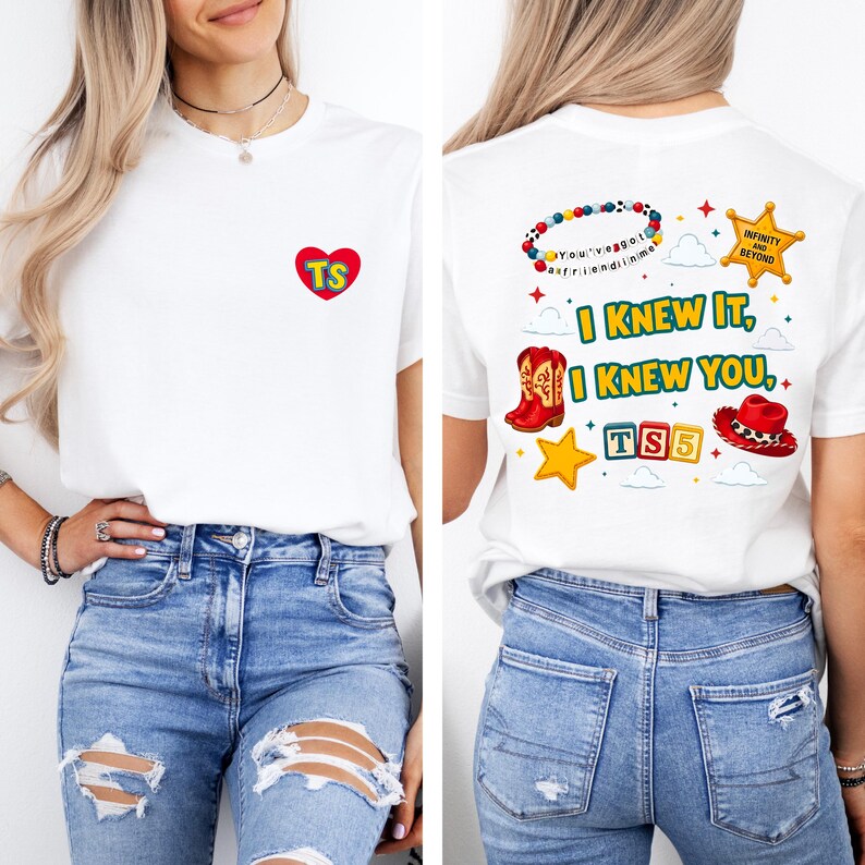 May include: A white t-shirt featuring a small red heart with the letters TS on the front. The back displays a colorful graphic with a beaded bracelet, a sheriff star, a cowboy boot, a red hat, blocks spelling TS5, and the text I KNEW IT, I KNEW YOU.