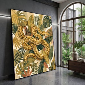 May include: Large framed art print featuring a coiled snake in shades of yellow and brown, set against a backdrop of lush green and tan tropical foliage. The artwork is displayed in a modern interior setting.
