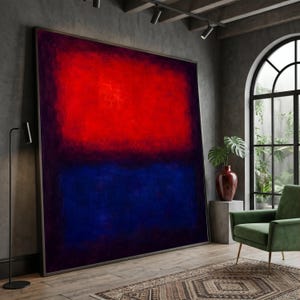 Puede incluir: Una pintura sobre lienzo rectangular de gran tamaño que presenta dos bloques de color horizontales distintos, con una sección roja vibrante que ocupa la mitad superior y una sección azul profundo que cubre la mitad inferior, enmarcada en un borde de metal oscuro.