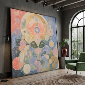 Puede incluir: Una gran pieza de arte mural cuadrada que presenta una composición abstracta simétrica de círculos superpuestos, líneas curvas y formas orgánicas en una paleta de rosa suave, azul apagado, oro y verde salvia, enmarcada en un borde negro fino.