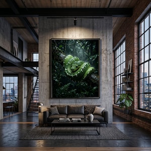 May include: A framed print of a green snake coiled on a branch in a rainforest setting. The artwork hangs above a dark grey sofa in a modern living room with exposed brick walls and large windows overlooking a cityscape.