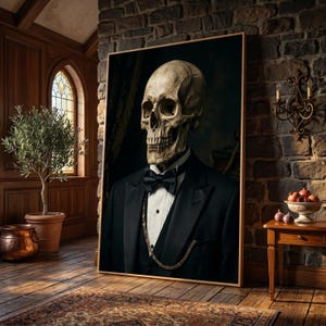 May include: A framed wall art print featuring a portrait of a human skull wearing a formal black tuxedo jacket, a crisp white dress shirt, a black bow tie, and a gold pocket watch chain draped across the front of the dark suit vest.