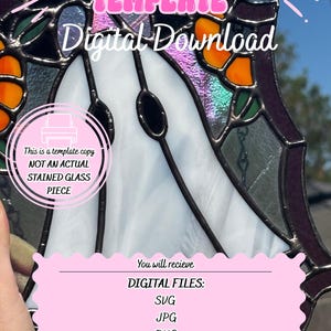 May include: A digital download stained glass template featuring a white ghost shape with orange accents and dark purple borders. Text reads: STAINED GLASS TEMPLATE, Digital Download, This is a template copy NOT AN ACTUAL STAINED GLASS PIECE, DIGITAL FILES: SVG, JPG, PNG, PDF, PDF numbered sheet.