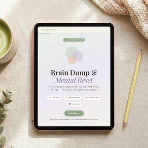 May include: A digital tablet displaying the words "Brain Dump & Mental Reset" with a latte, pencil, and a beige sweater. The tablet screen has a gradient background with colorful circles and buttons.