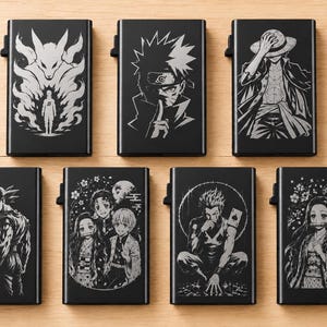 May include: Seven rectangular black metal card holders, each featuring a distinct laser-engraved anime character illustration in white. The designs include figures such as a fox spirit, a ninja, a pirate, a warrior, and various anime group scenes.