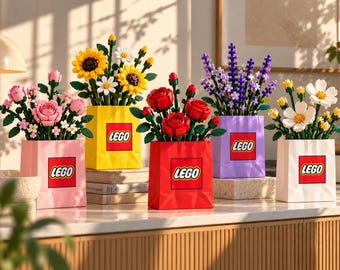May include: Five LEGO brick-built flower arrangements in colorful square bags. Each bag features the red and white LEGO logo. The bouquets include pink roses, yellow sunflowers, red roses, purple lavender, and white cosmos, all with green stems and leaves.