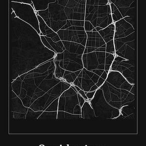 May include: A black and white map print of Madrid, Spain, featuring a detailed street grid and highway network. Below the map, the text reads Our Adventures, followed by MADRID, SPAIN and the coordinates 40.4168 N / 3.7038 W in white font.