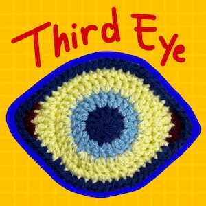 May include: A circular crochet patch featuring a concentric eye design with a dark blue center, a light blue ring, and a pale yellow outer layer. The text "Third Eye" is written in red above the patch against a yellow grid background.