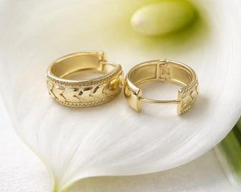 Earrings featuring gold plated hearts