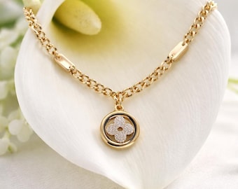 gold-plated chain with a clover pendant
